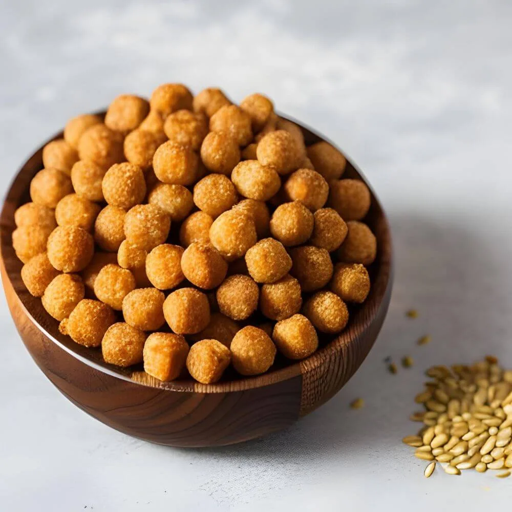 Small snack balls filled with mealworms and sunflower seeds in a bowl